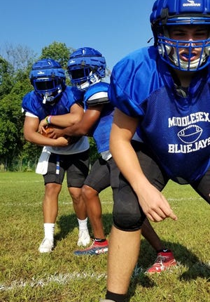 Middlesex High School football players at a practice in 2021