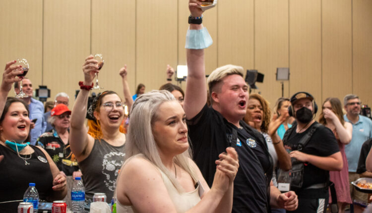 Attendees of the Kansans for Constitutional Freedom watch party celebrate after primary election results verify Kansans voted to keep abortion a constitutional right on Tuesday. (Lily O’Shea Becker/Kansas Reflector)