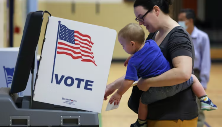 WOMAN VOTER WITH BABY
