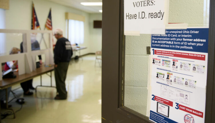 A voter checks in at an Ohio polling place. Ohio was one of eight Republican-led states that left an interstate cooperative to keep clean voter rolls (Photo by Scott Olson/Getty Images).
