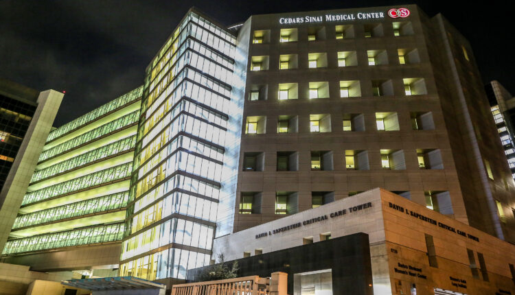 A photo of Cedars-Sinai Medical Center in Los Angeles at night.
