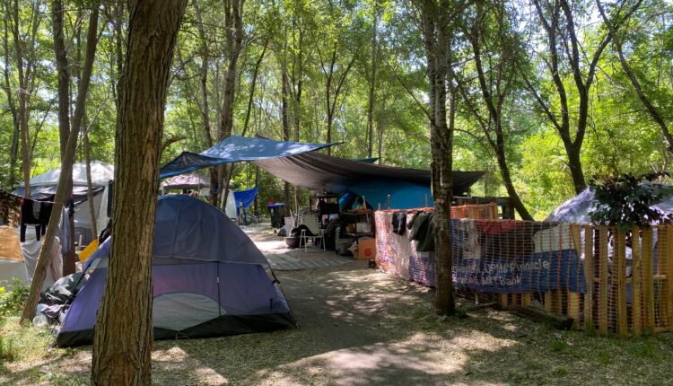 As HBG prepares to clear unhoused encampment, occupants wait, wonder what comes next