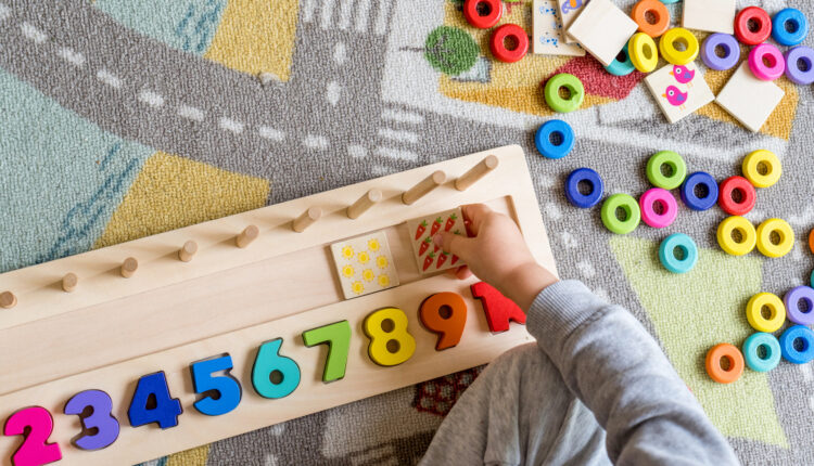 Baby toddler early development. Wooden stack and count rainbow colors learning game. Child learn colors and numbers